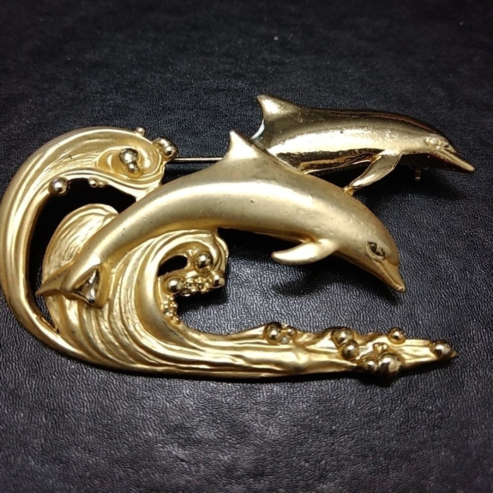 AJC gold tone dolphin brooch